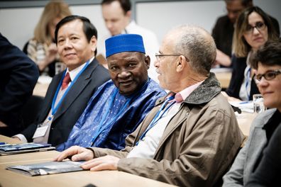 A group of international alumni at a conference