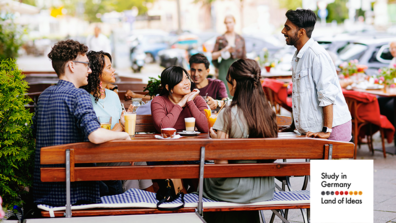 Students sitting outside in a café