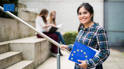 A young woman smiles at the camera  - EU Higher Education Cooperation